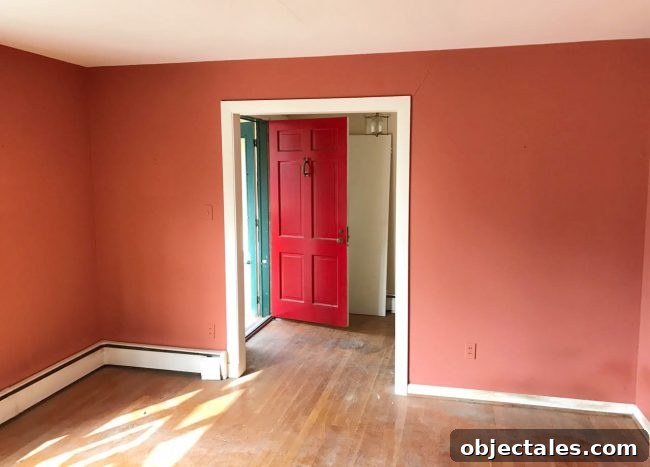 Turn Your House Into a Rental: Renovation Checklist 4 Renovated kitchen with white cabinets and black countertop