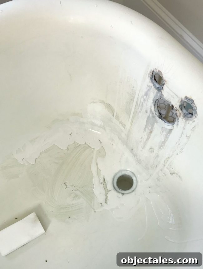 Refinish Your Old Clawfoot Tub: Step-by-Step Guide 9 Soft cleanser and magic eraser in clawfoot tub
