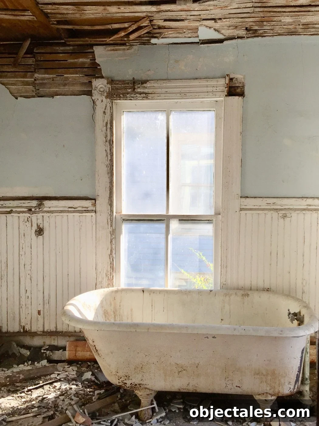 Refinish Your Old Clawfoot Tub: Step-by-Step Guide 4 Before photo of beach house bathroom with crumbling walls and dirty tub