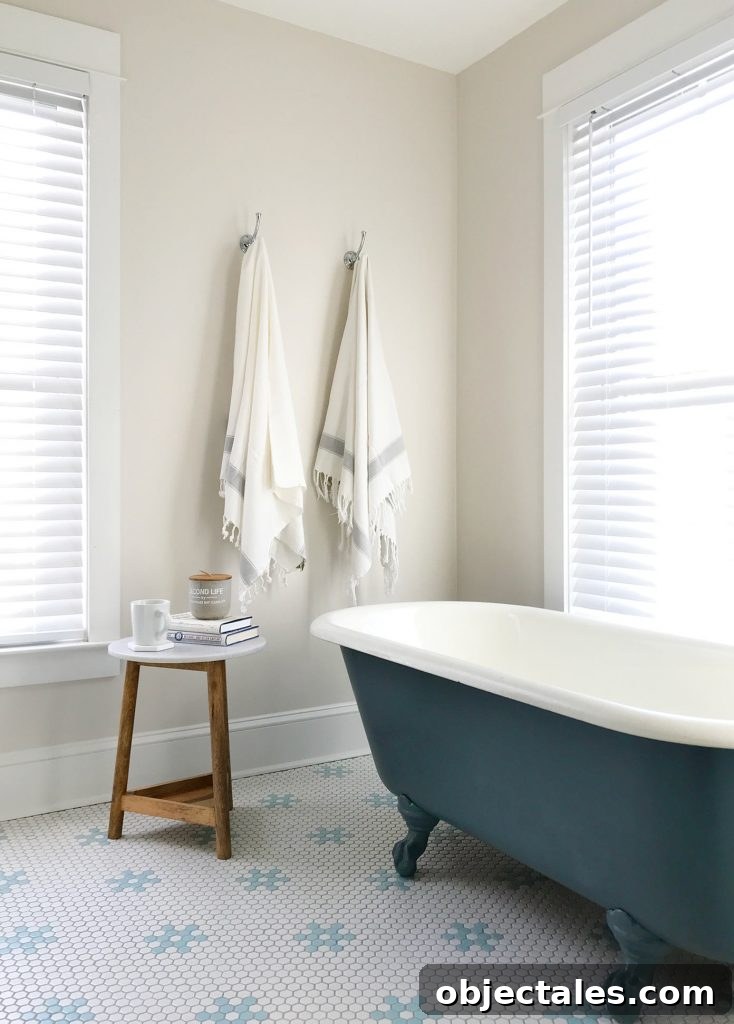 Refinish Your Old Clawfoot Tub: Step-by-Step Guide 5 White bathroom with navy blue refinished clawfoot tub
