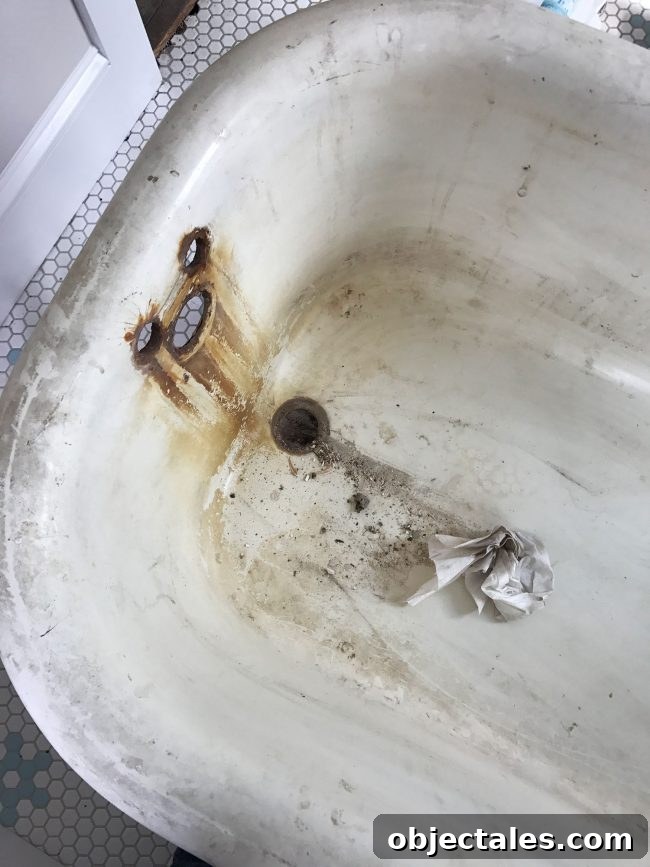 Refinish Your Old Clawfoot Tub: Step-by-Step Guide 7 Rust stains around faucet holes in clawfoot tub