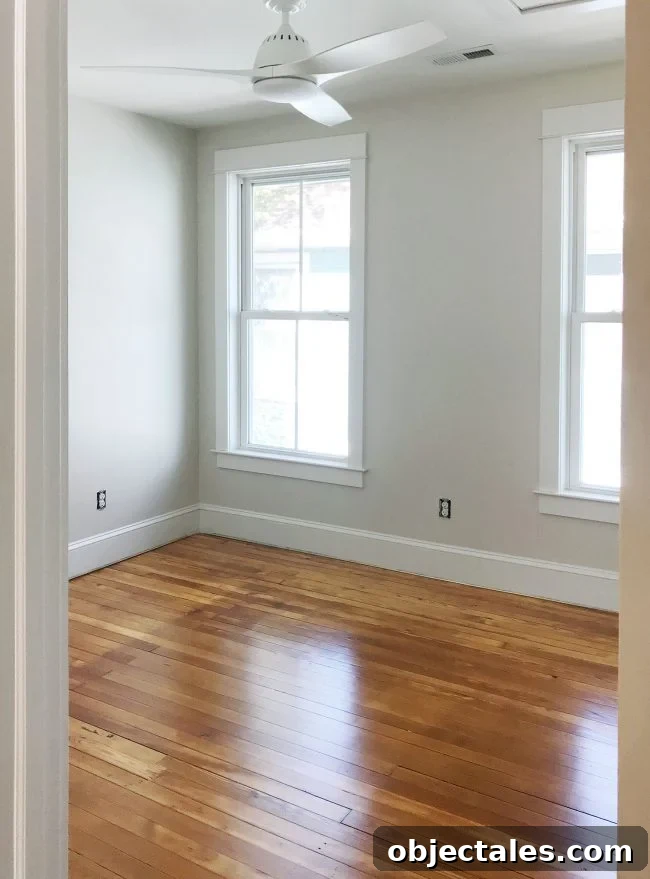 Heart Pine Floor Refinishing: Before and After Results 13 refinished pine floors upstairs bedroom white fan