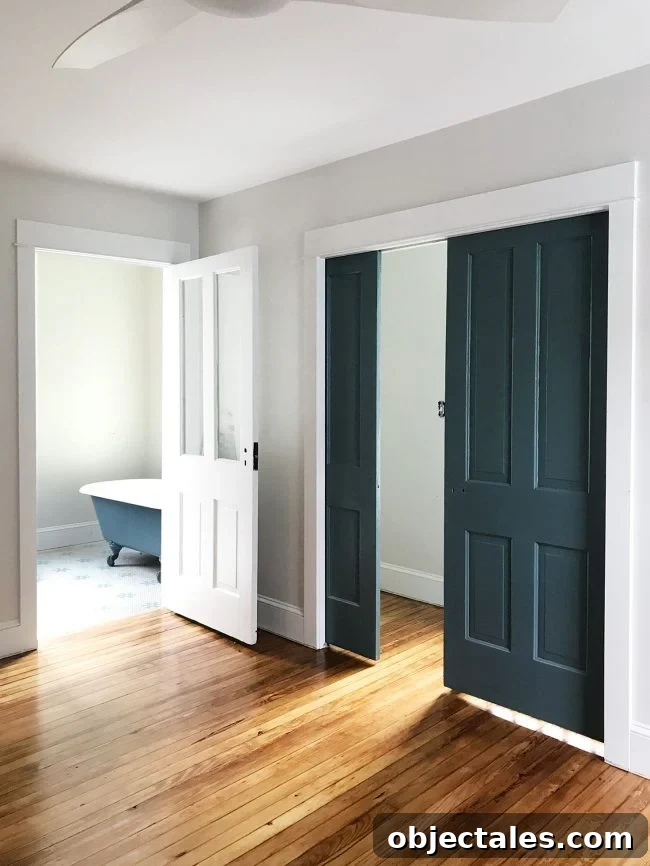 Heart Pine Floor Refinishing: Before and After Results 14 painted pocket doors navy