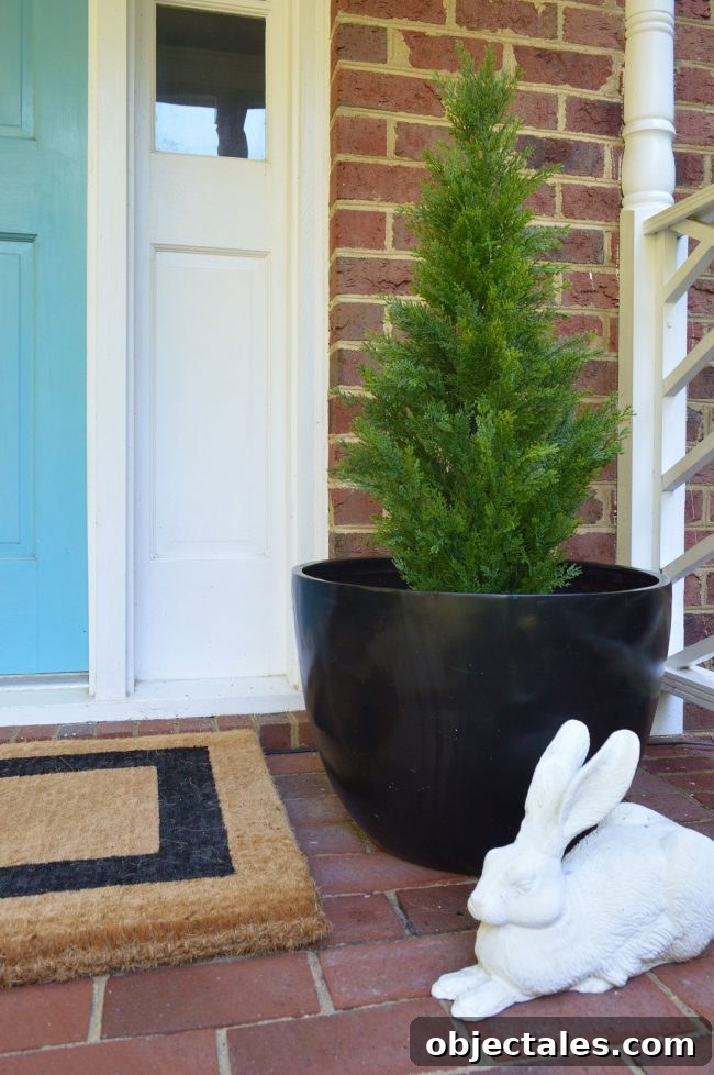 Fake Plant Evergreen In Black Planter On Front Porch
