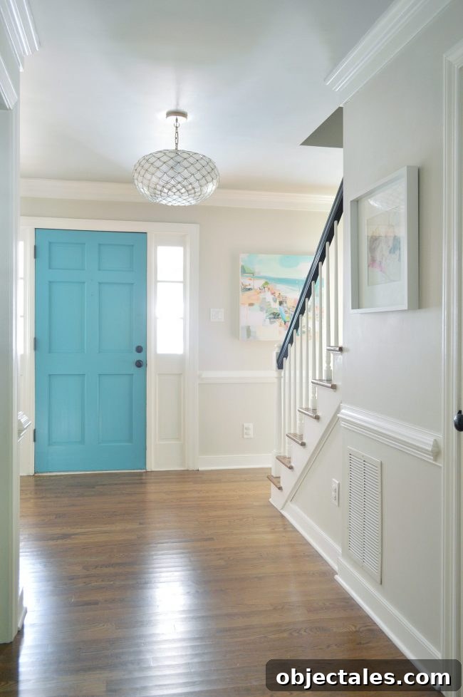 neutral foyer edgecomb gray with blue front door