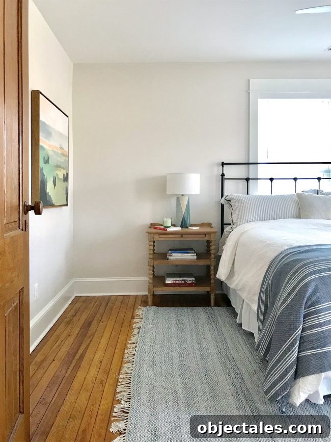 Front bedroom with art and rug