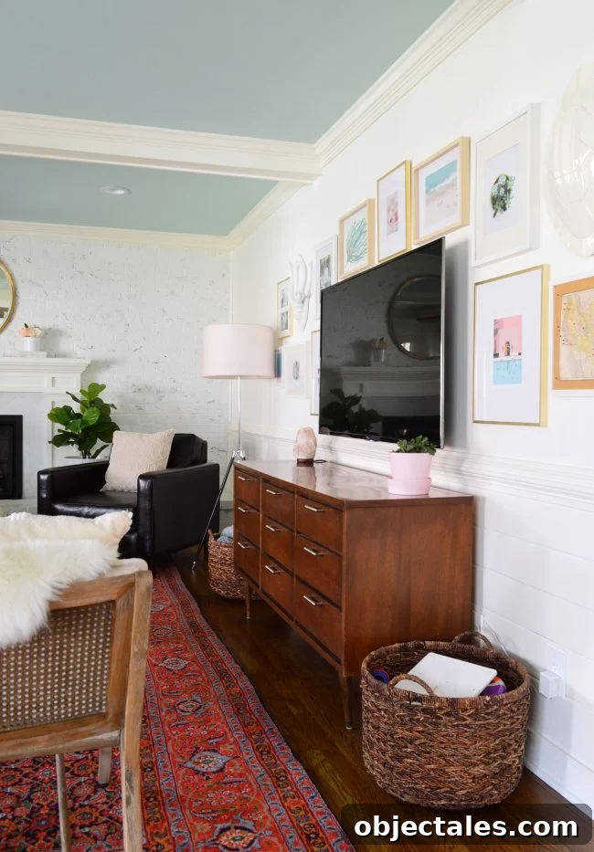 picture frame gallery wall in living room around a mounted TV