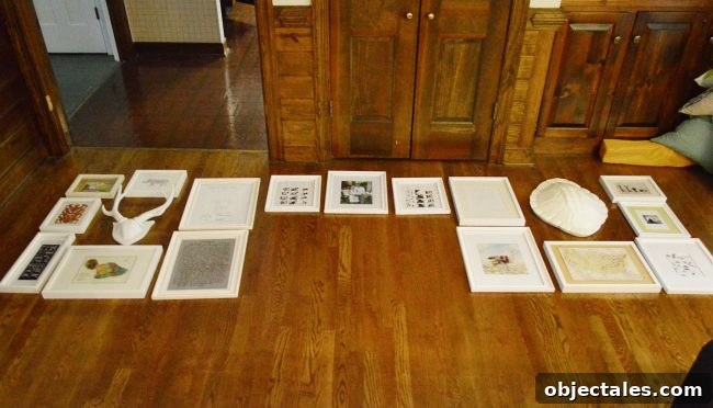 picture frames laid out on a floor in preparation for gallery wall