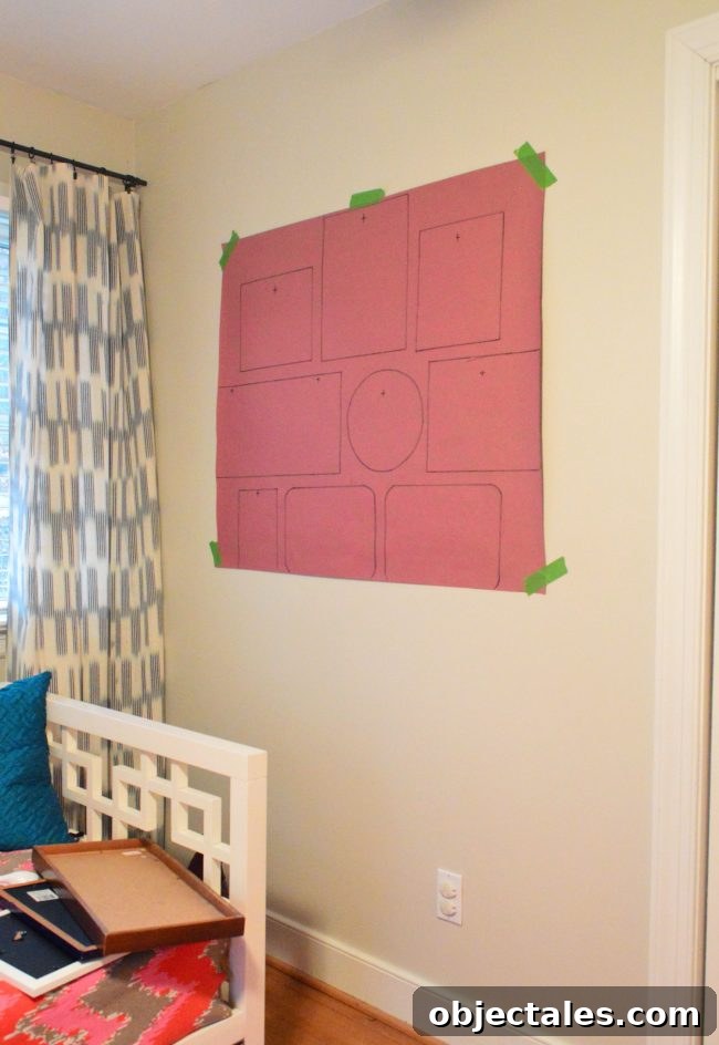 How to Hang Picture Frames Around a Wall-Mounted TV 8 red rosin paper taped to wall with frame outlines drawn for gallery
