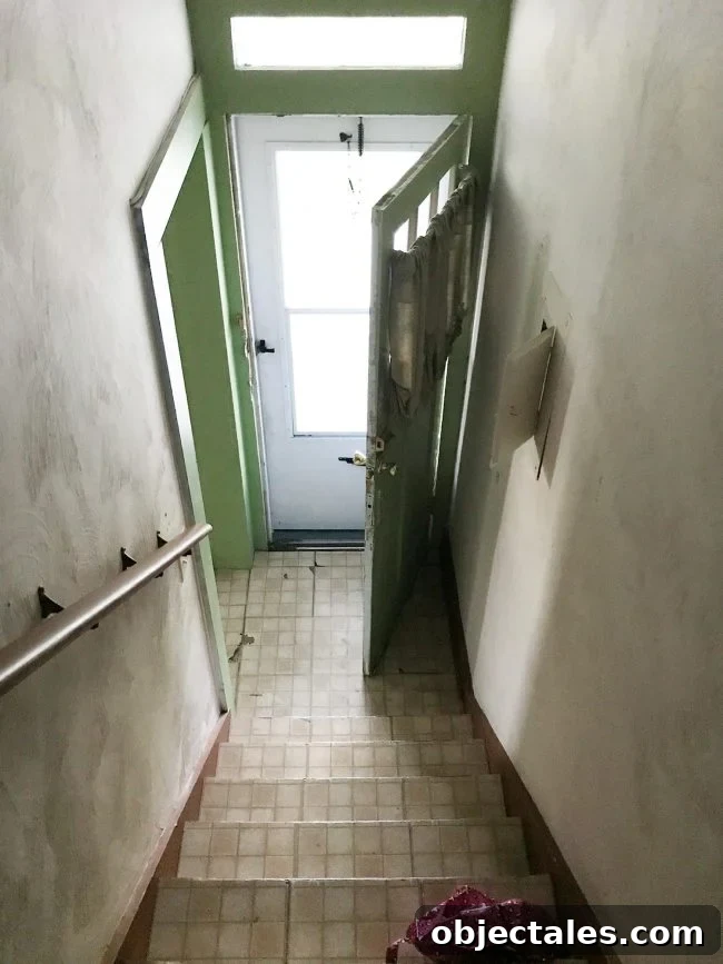 Before photo of stairwell in duplex renovation
