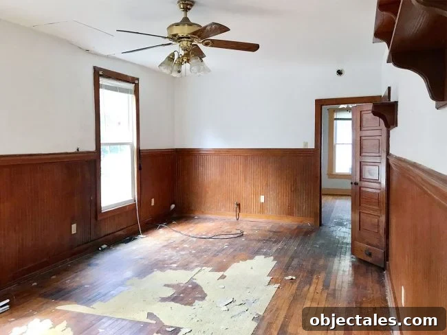 Before photo of living room in historic beach duplex in Cape Charles Virginia