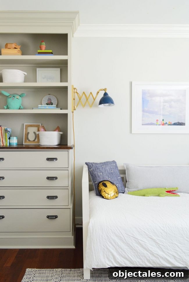 Daybed against built-ins with sconces