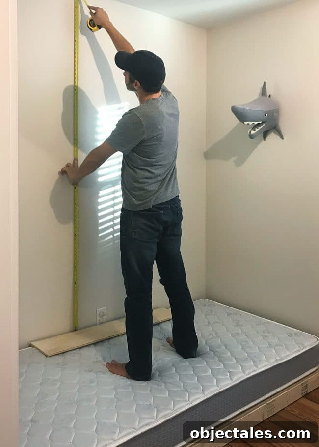 How to Build Built-In Bunk Beds: Step-by-Step Guide 10 John measuring height and placement of top bunk