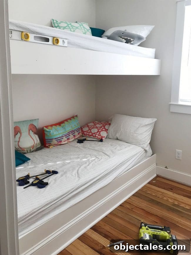 How to Build Built-In Bunk Beds: Step-by-Step Guide 14 white trim pieces added to the face of bunk bed platforms