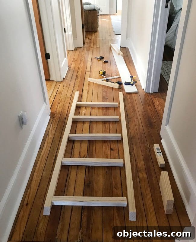 How to Build Built-In Bunk Beds: Step-by-Step Guide 16 bunk bed ladder pieces laid out in hallway for construction