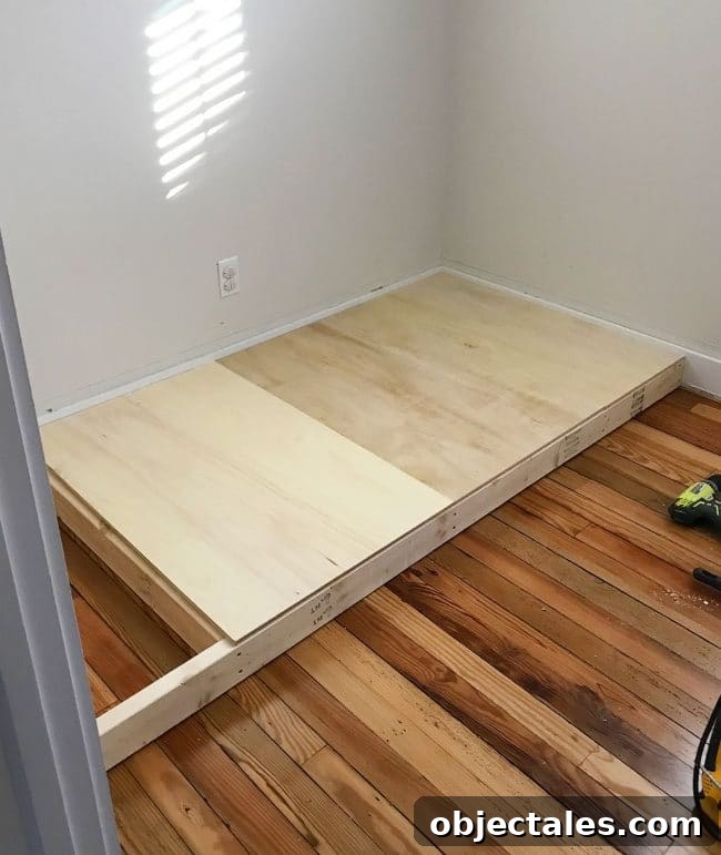How to Build Built-In Bunk Beds: Step-by-Step Guide 8 adding plywood to create base of bottom bunk bed