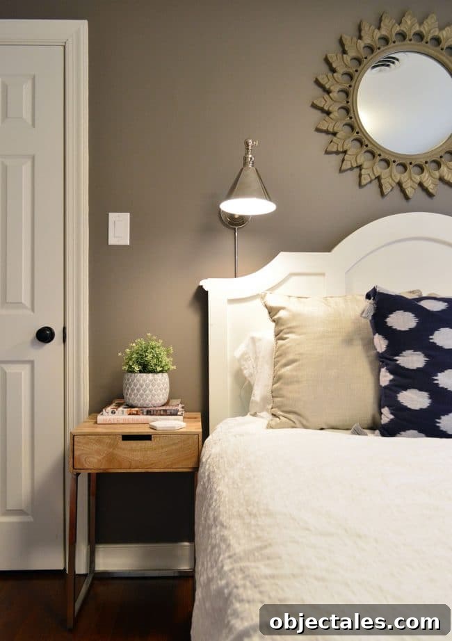 Metal bedside sconce with LED light bulb
