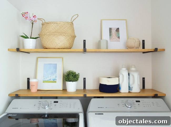 Conceal Your Water Heater with an IKEA Cabinet 10 open shelves above top loading washing with dark iron brackets and wood shelves
