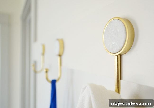 Build a Long Hook Rail for Your Mudroom 7 detail photo of marble circle insert on gold hook from target