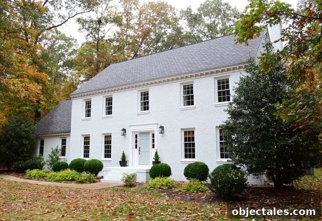 How We Painted Our Brick House White 11 after photo of brick house painted moderne white in fall foliage