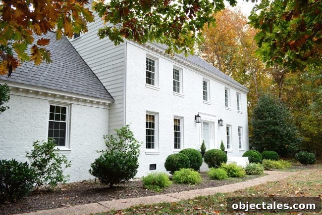 How We Painted Our Brick House White 3 moderne white painted brick house with blue door