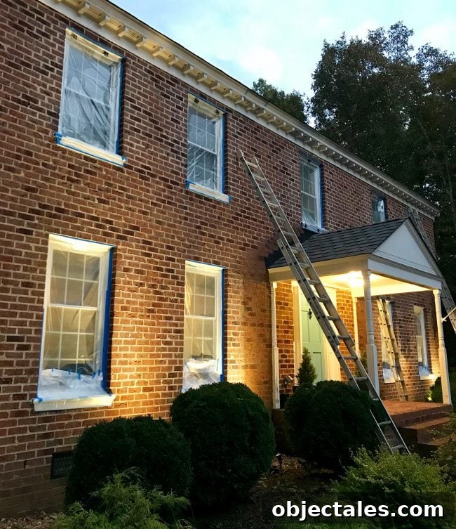 How We Painted Our Brick House White 18 brick house prepped for painting with windows taped up