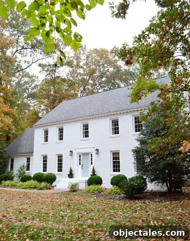 How We Painted Our Brick House White 22 after photo of brick house painted moderne white with tranquility blue door
