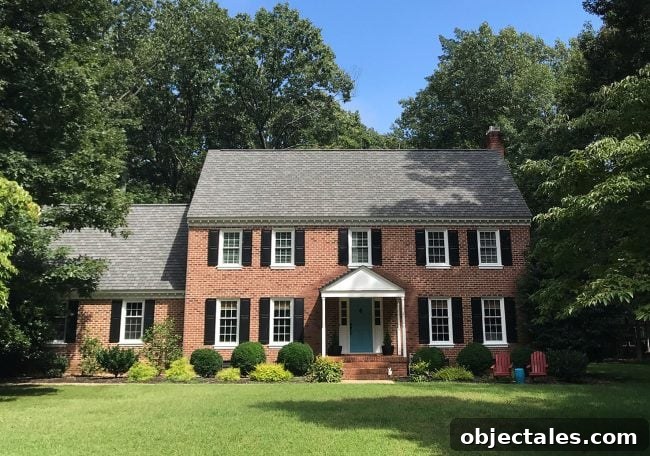 How We Painted Our Brick House White 10 before photo of brick house with black shutters to be painted white