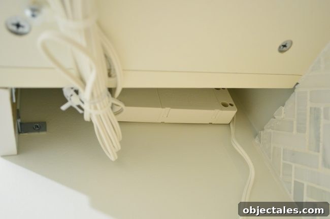 Transformer mounted behind cabinet filler