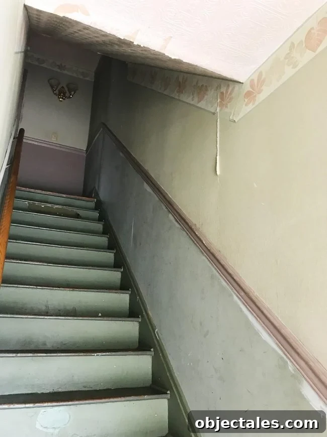 Before: low sloped ceiling over stairs