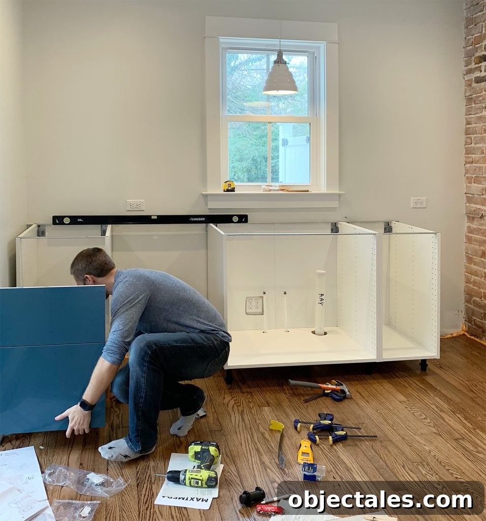 Installing cabinet rail against bowed wall