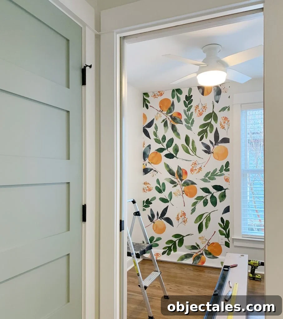 How to Install a Peel-and-Stick Wall Mural 5 Removable Orange Blossom Wallpaper Installation With Blue Painted Door
