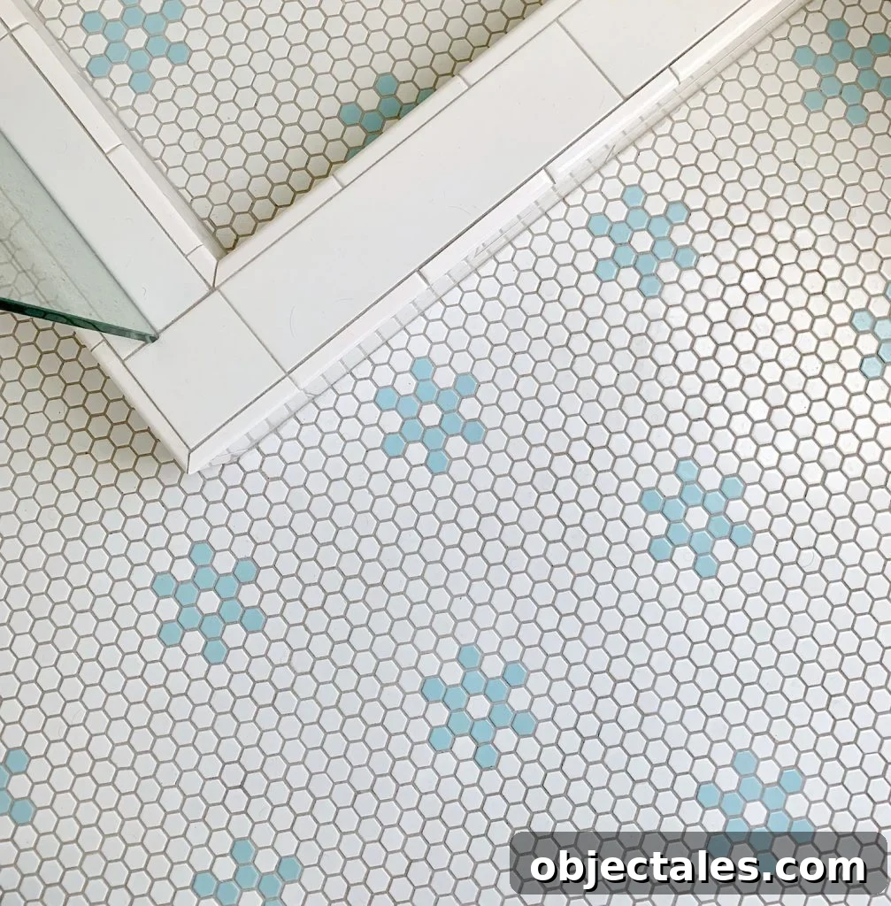 Hex tile bathroom floor with aqua blue flower shapes