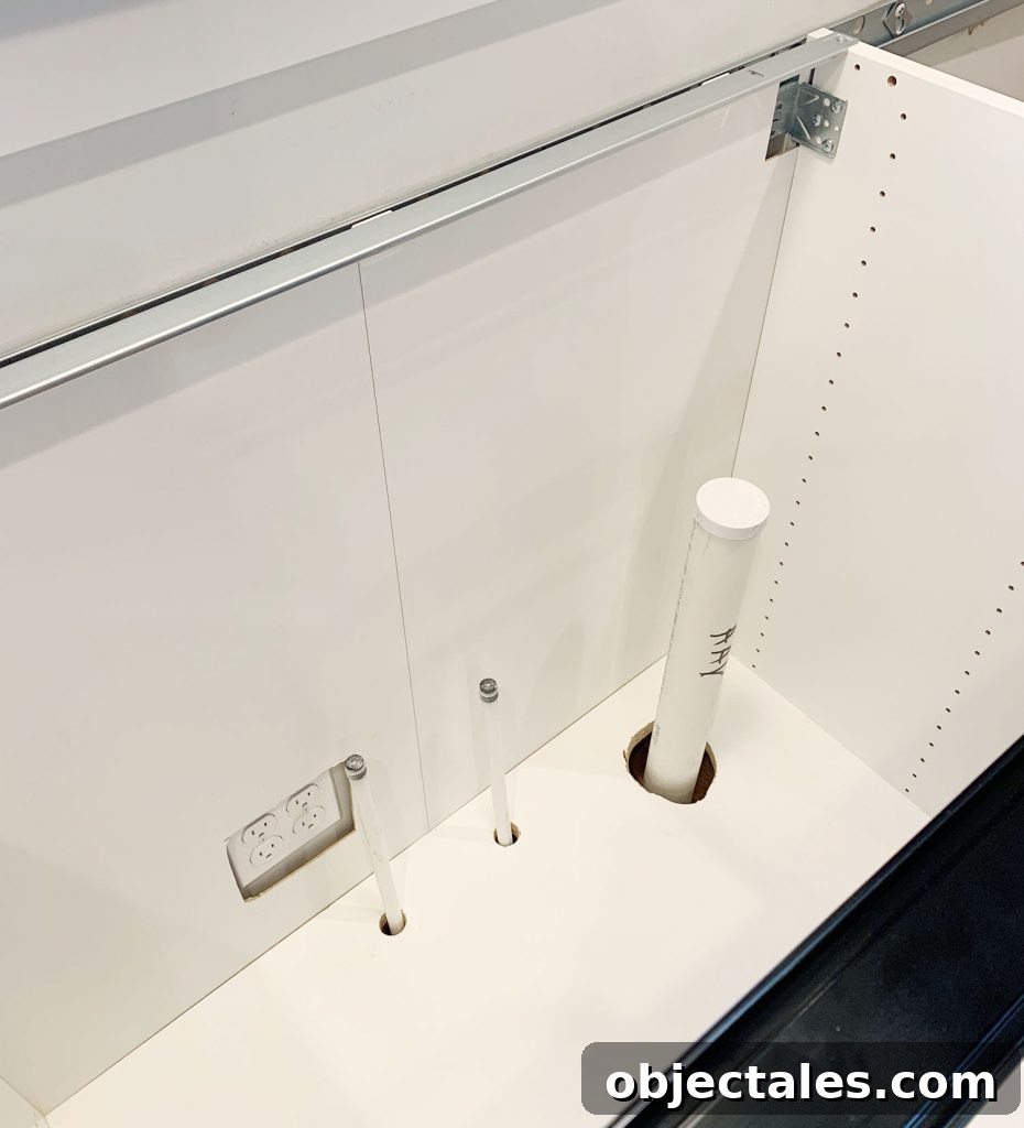 How to Install IKEA Kitchen Cabinets: Step-by-Step 16 Cutting cabinet back for plumbing