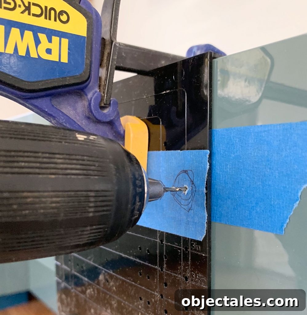 How to Install Cabinet Hardware: A Complete Guide 12 Drillign Pilot Hole Through Hardware Template Clamped To Drawer Front