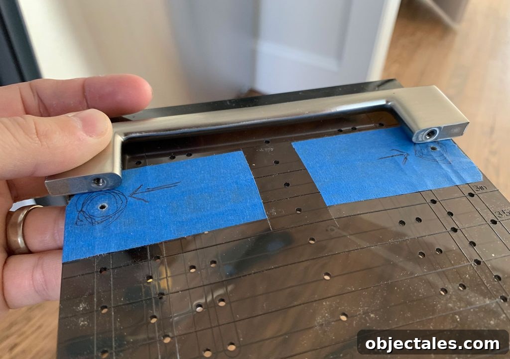 How to Install Cabinet Hardware: A Complete Guide 5 Cabinet Hardware Template Lined Up With Holes On Pull