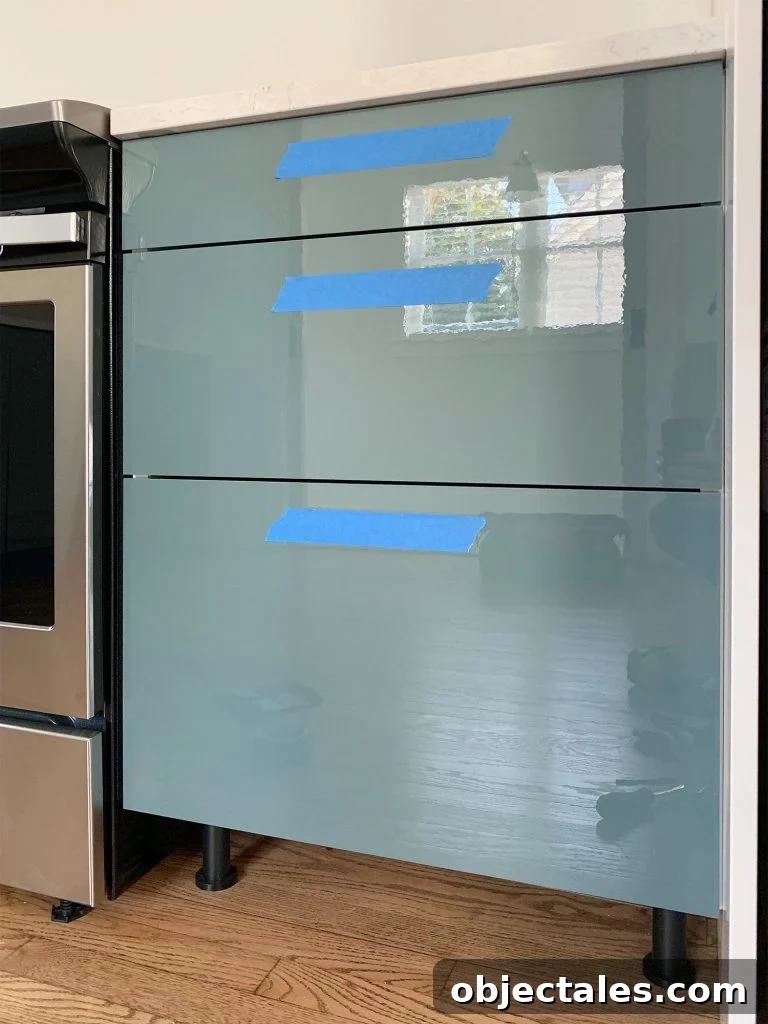 How to Install Cabinet Hardware: A Complete Guide 6 Protective Blue Tape Attached To Kitchen Drawer Fronts