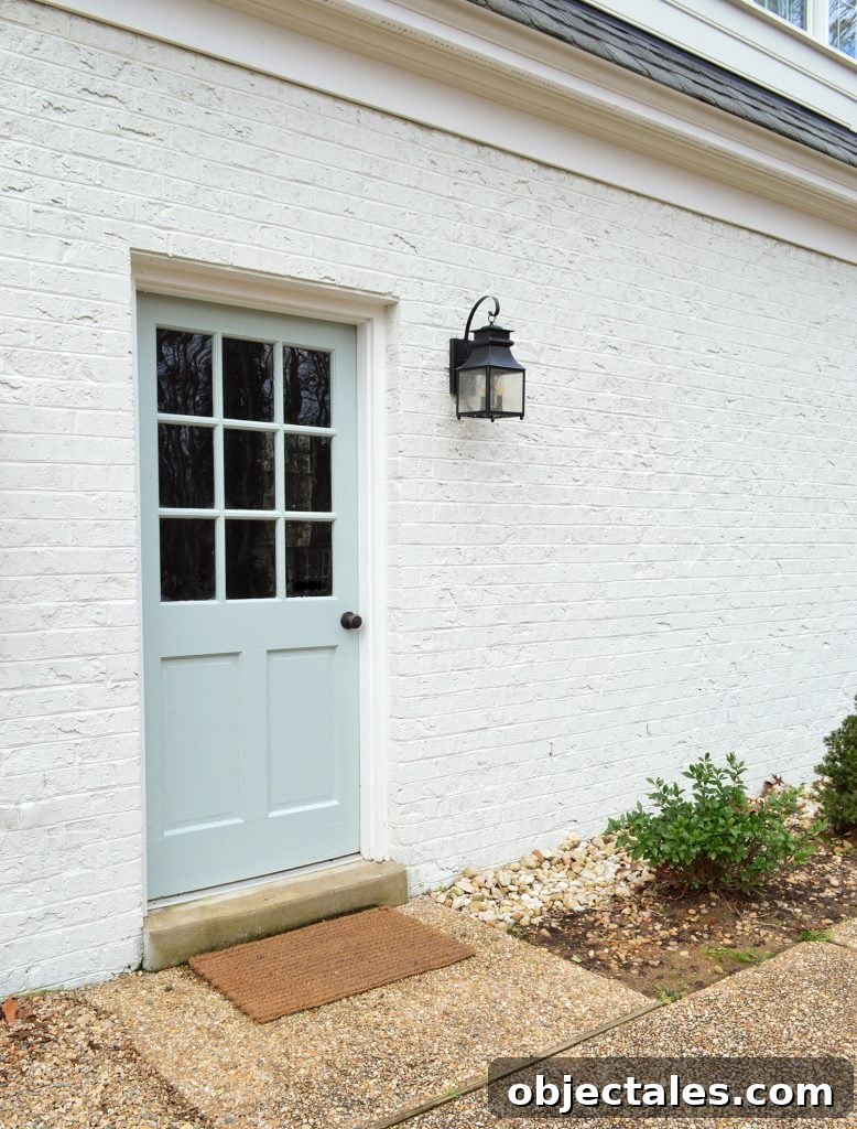Back Door Painted Tranquility In High Gloss Against White Brick Garage