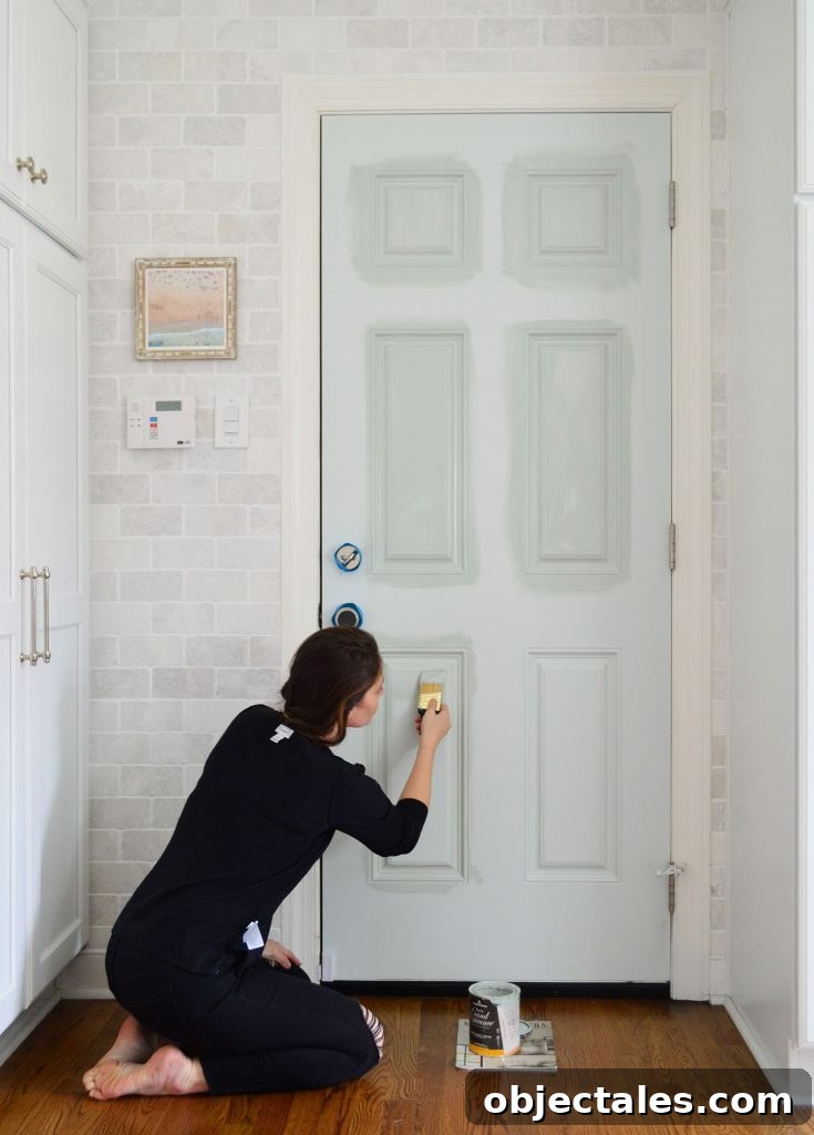 Sherry Applying High Gloss Paint To Kitchen Door With Short Angled Brush
