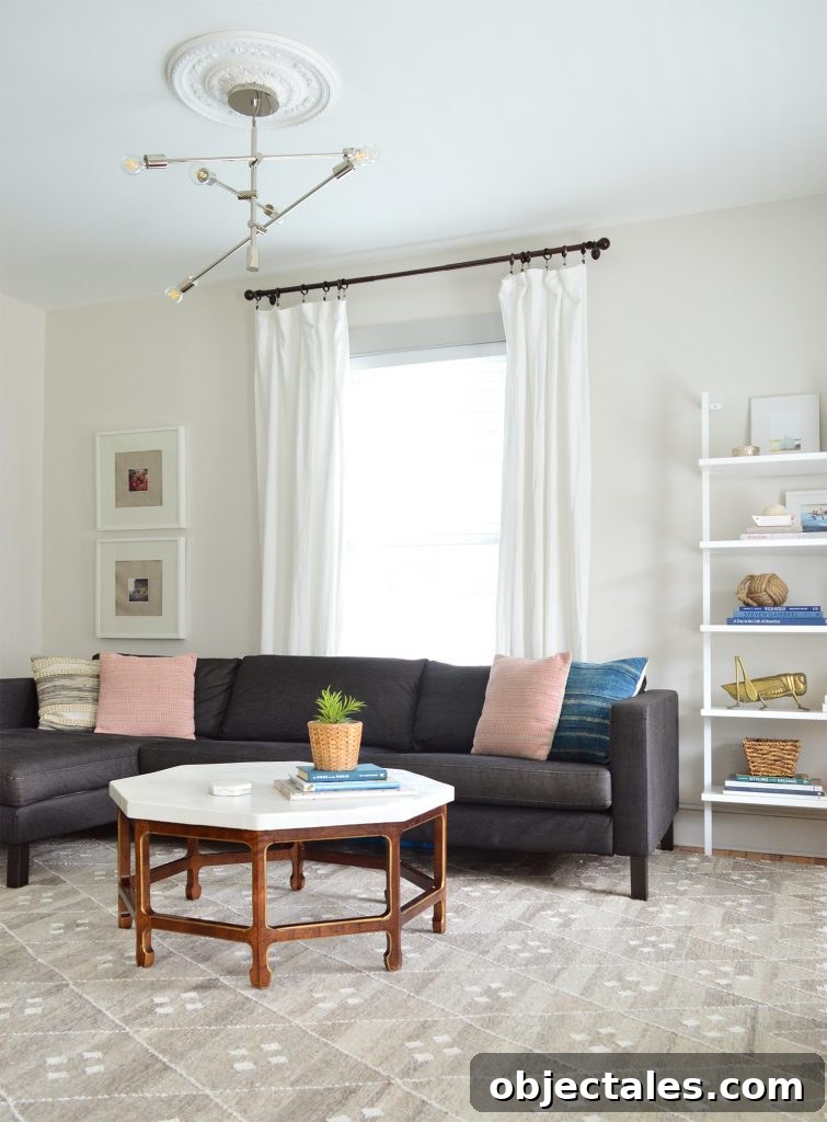 neutral living room with dark charcoal ikea sectional