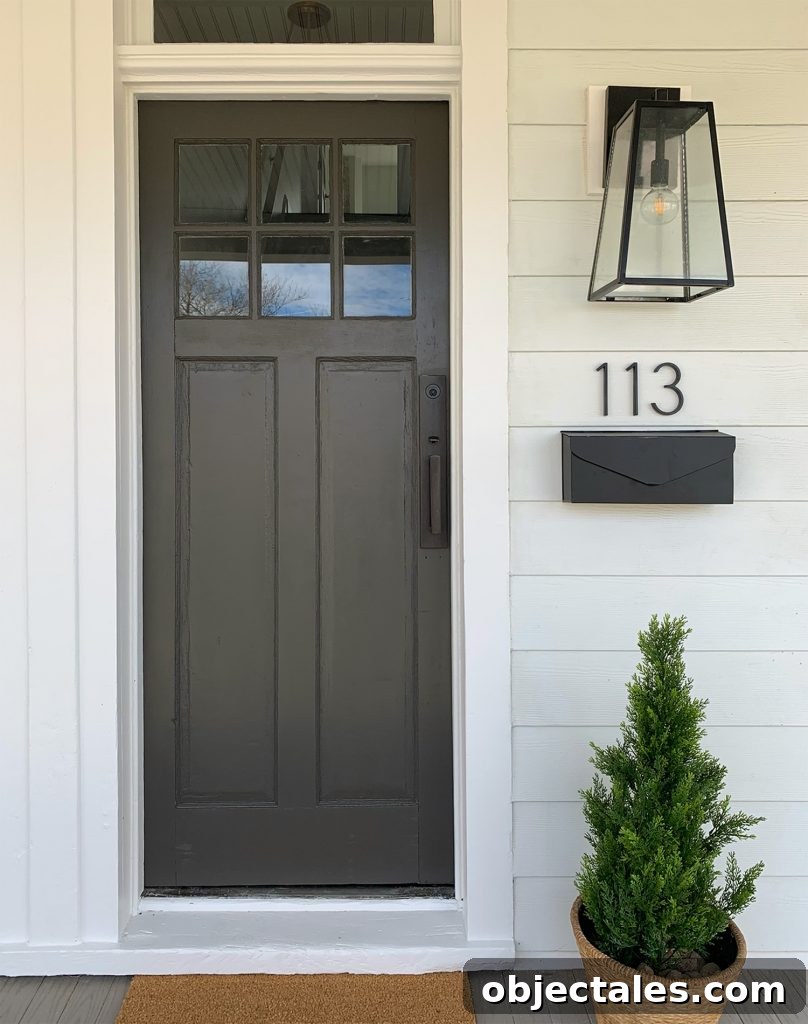Duplex Front Porch Makeover: Stunning Before & After 12 One Side Of Duplex Front Porch With Dark Door And Hardware