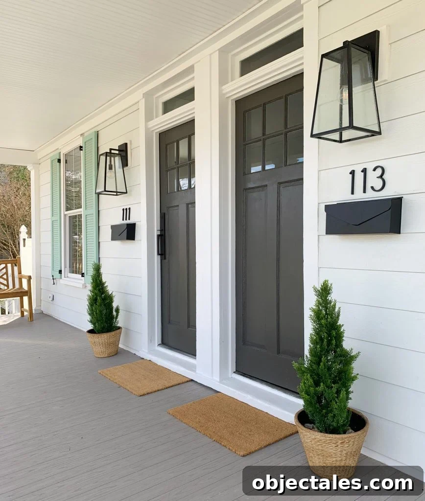 Duplex Front Porch Makeover: Stunning Before & After 6 Duplex Front Porch From Angle With Doormats Planters And Benches In Similar Color