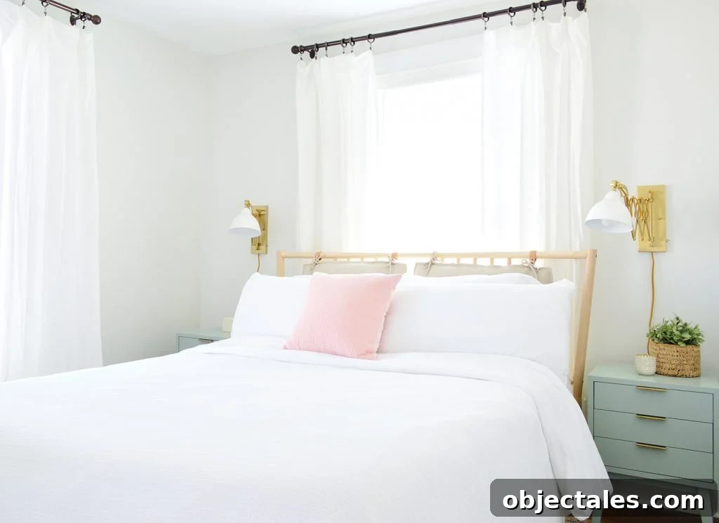 Duplex guest bedroom with bed in front of window