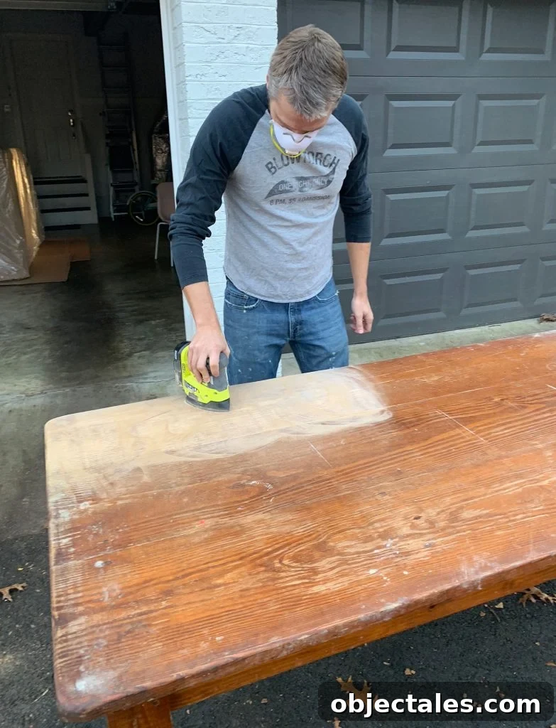 Refinish Your Table: Step-by-Step Guide to a Smooth Finish 7 John Sanding The Finish Off Wood Dining Table