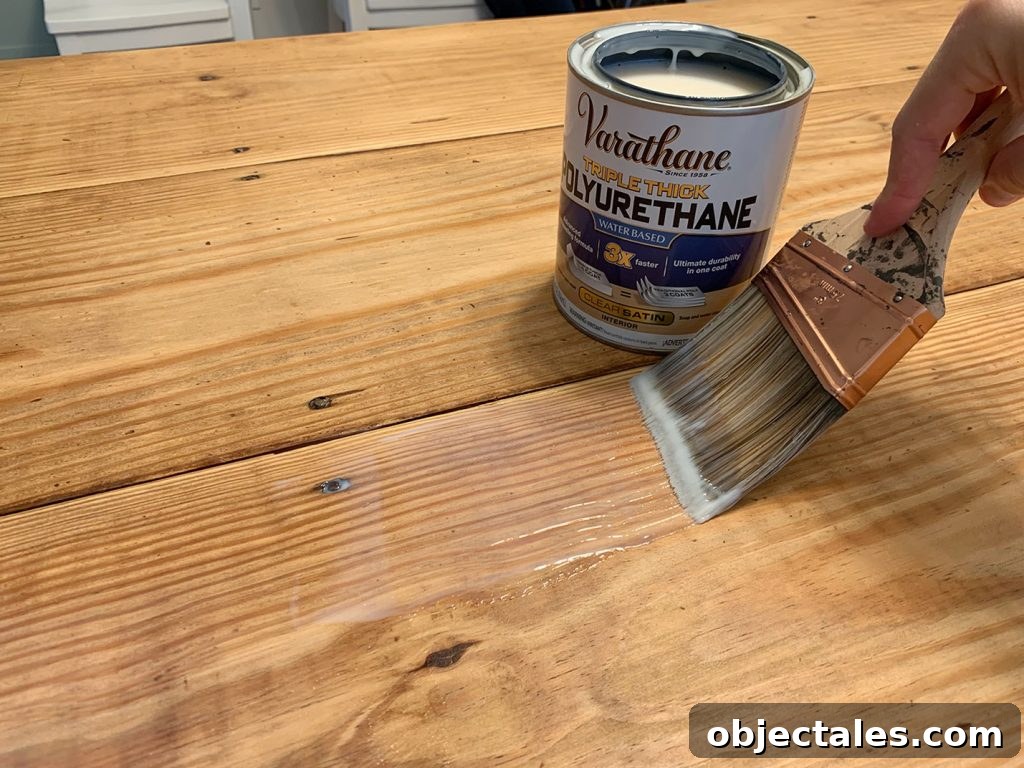Refinish Your Table: Step-by-Step Guide to a Smooth Finish 10 Clear Sealer Being Applied To Wood Dining Table With No Stain