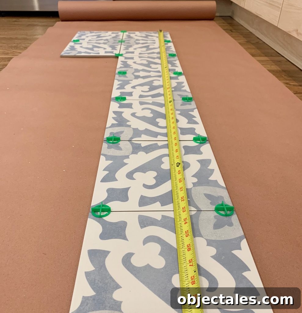 Measuring Tape On Patterned Backsplash Tile To Find Length