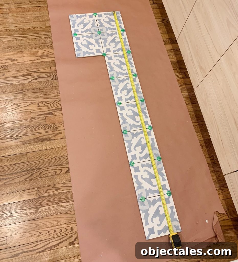 Backsplash Tile Laid On Floor To Determine Length And Pattern