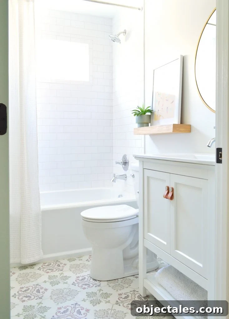 Hall bathroom with tonal tile and floating shelf