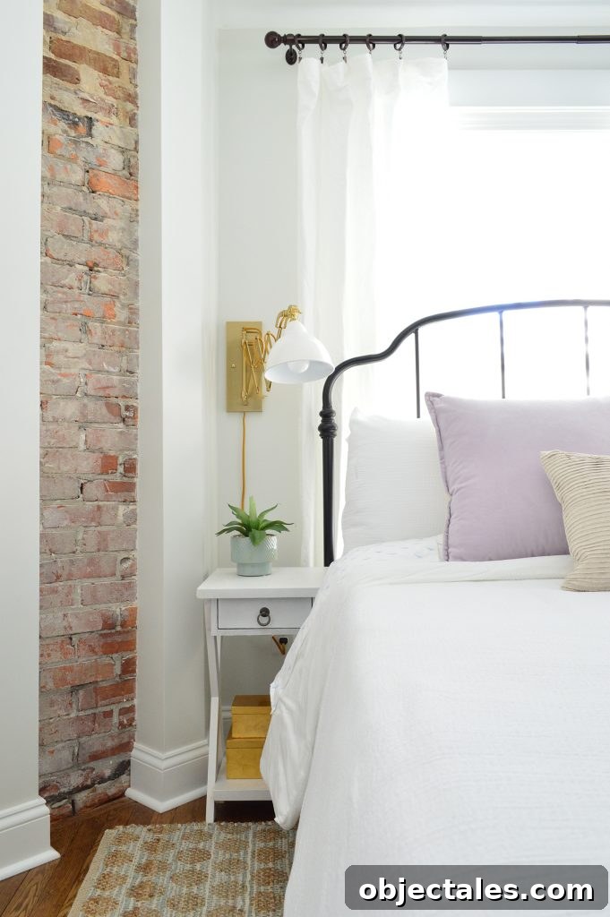 Bedroom styling with metal bed and curtains