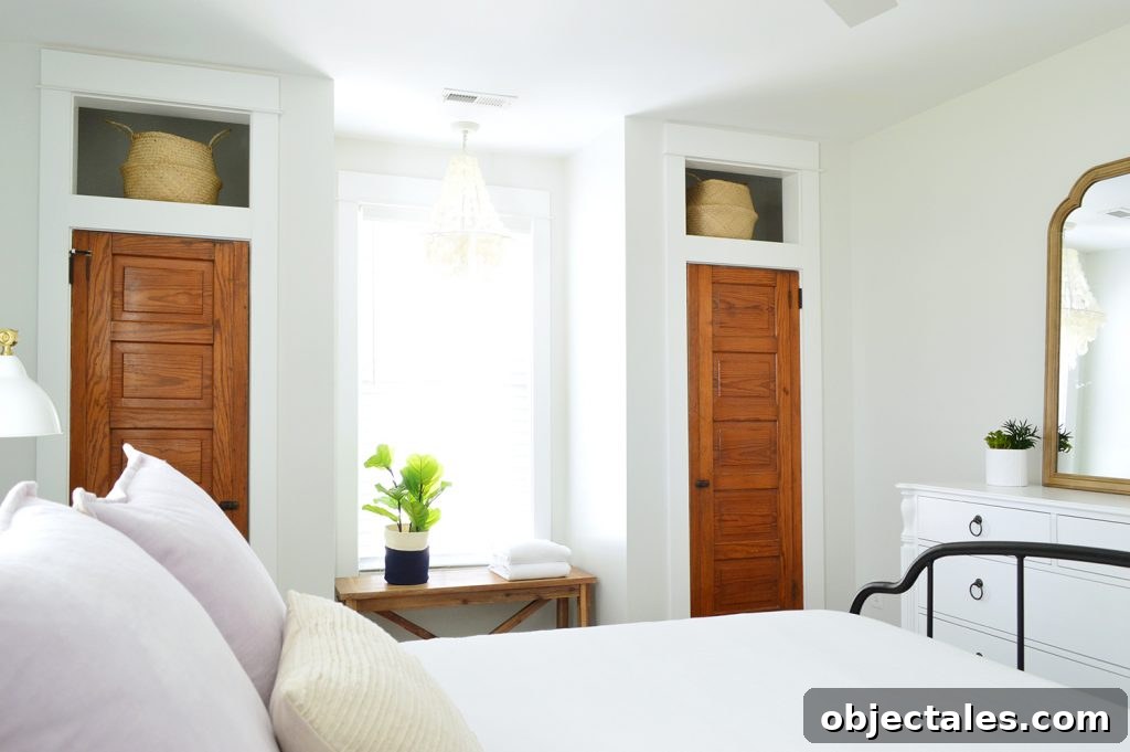 Bedroom with original doors and built-in closets